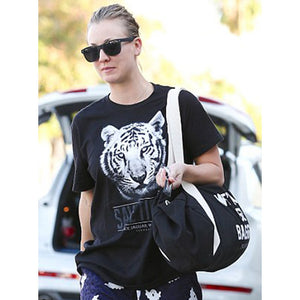 Kaley Cuoco sporting the We've All Got Baggage Duffle